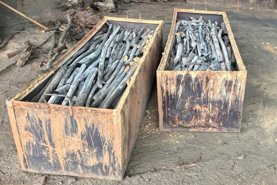 Cooled eucalyptus white charcoal sticks in wooden crates
